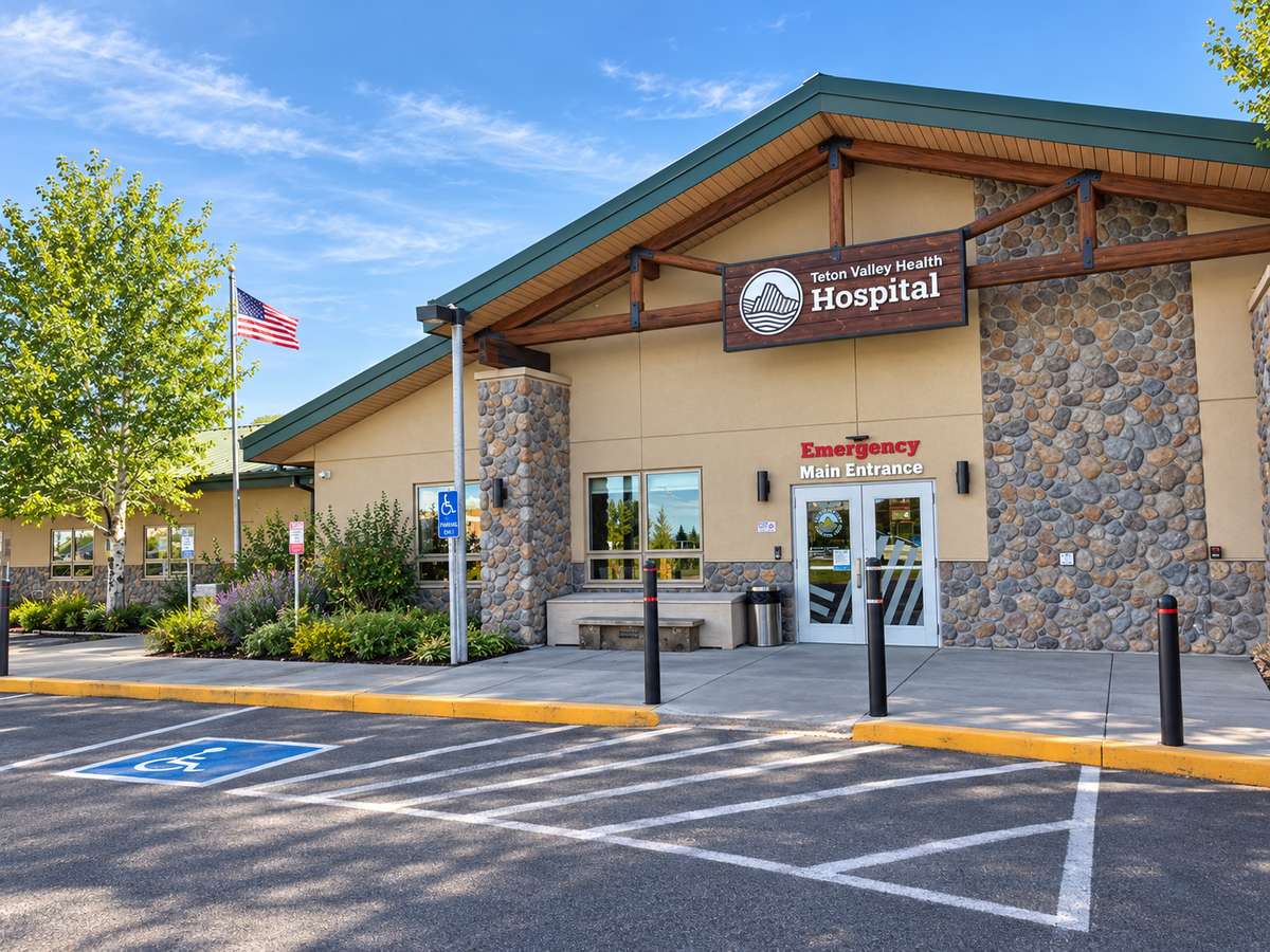Teton Valley Health Hospital's stone-and-timber main entrance, marked "Emergency Main Entrance"